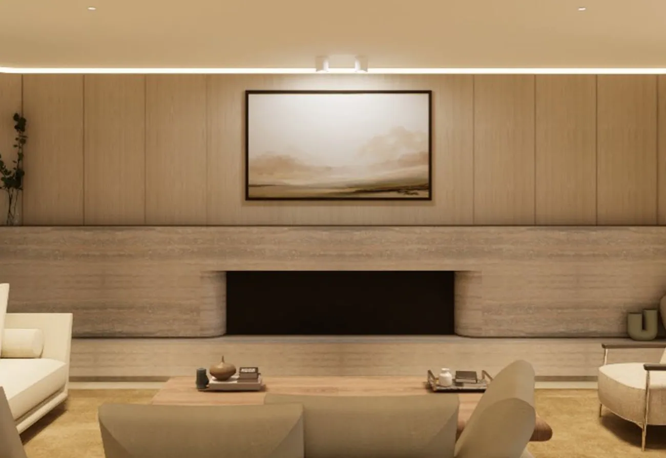 Living room at the Mosman residence with a timber lined wall, low seating and a long horizontal fireplace.