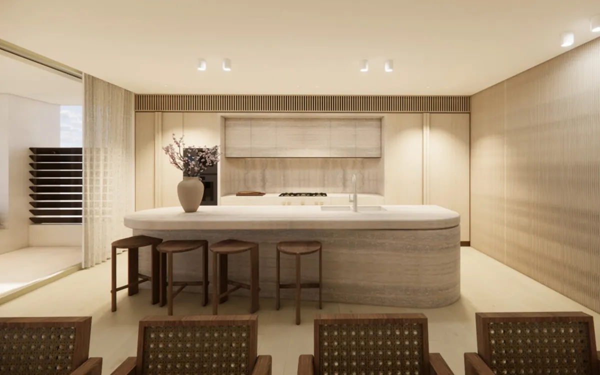Kitchen at the Mosman residence with a stone island, timber joinery and woven stools.
